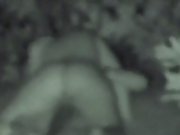 Amateur couple sex in the bushes in a public park at night