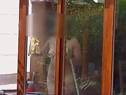 Cleaning the windows naked for the neighbours to see