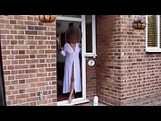 Sarah at the front door wearing a sheer robe